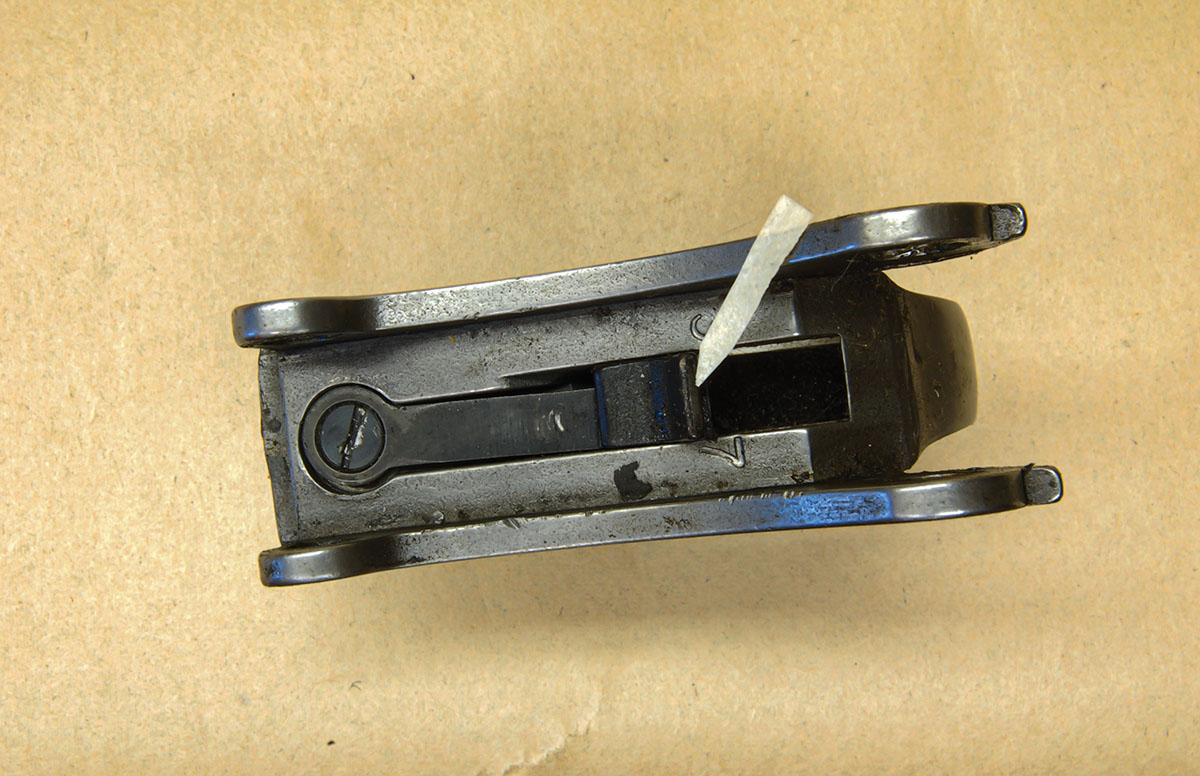 Looking down into the G.P. trigger guard, the arrow points to the top of the trigger. Anywhere below the surface could be fitted with a trigger-blocking safety.